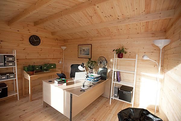 Log cabin office with electric lighting