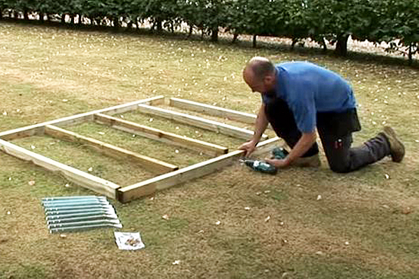 Pre-drilling beams on shed base