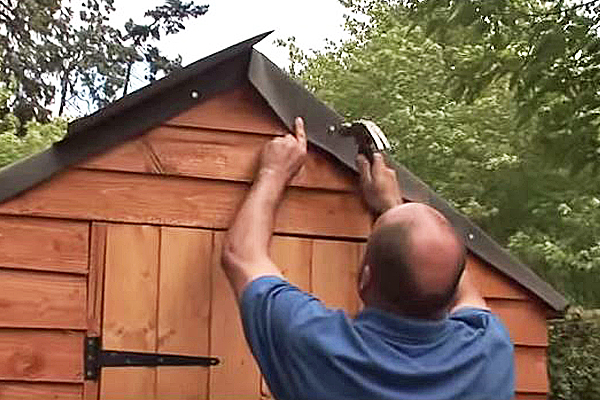 Tacking down roofing felt at apex